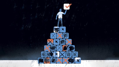 Stylized illustration of a person standing atop a pyramid made of blocks, most marked with red or black Xs, symbolizing failed or negative results. The person holds up a single block with a red checkmark, representing a successful or validated outcome. The background is dark, emphasizing contrast between failure and discovery, suggesting the value of learning from negative results in research or experimentation.
